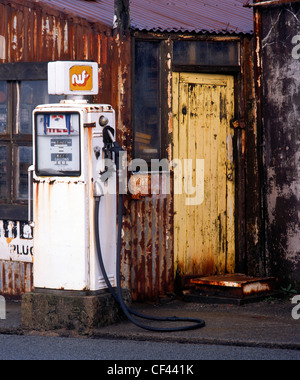 A disused petrol station displays a colourful array of decaying textures. Stock Photo