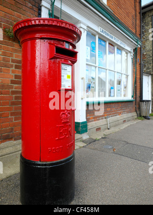 Lavenham post office and box. This famous Suffolk village, popular with tourists, was built on the back of money from the wool t Stock Photo