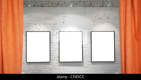 three frames on brick wall and draperies collage Stock Photo