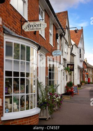 A view of shop fronts in Lavenham. This famous Suffolk village, popular with tourists, was built on the back of money from the w Stock Photo