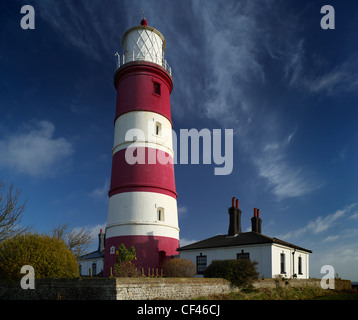 A view toward Happisburgh Lighthouse. It is the oldest working light in East Anglia and the only independently run lighthouse in Stock Photo