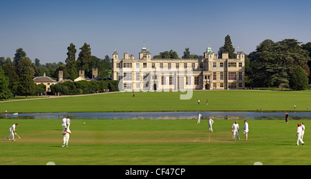 A cricket match played in front of Audley End house. Stock Photo