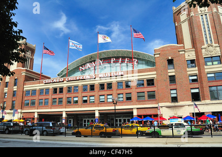 Taxi business is brisk as the vehicles shuttle tourists to Navy Pier and the Chicago Children's Museum. Chicago, Illinois, USA. Stock Photo