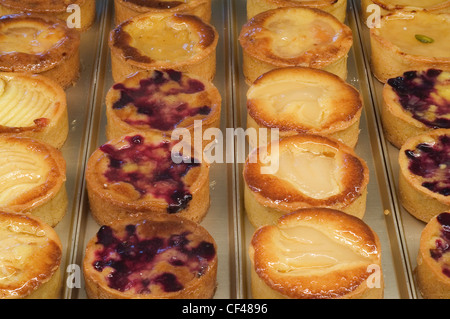 Pastries on display in pastry shop Stock Photo