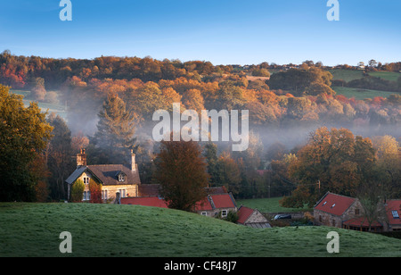 Early morning mist lingering over the small village of Egton Bridge and surrounding countryside. Stock Photo