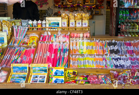 Sticks of rock and sweets on display in a sweet shop in Whitby. Stock Photo