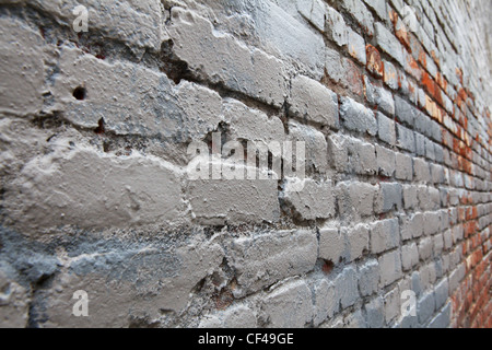 Weathered and worn Gray Brick in Perspective diminishing to the right Stock Photo