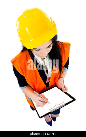 Woman engineer taking notes in clipboard - elevated view Stock Photo