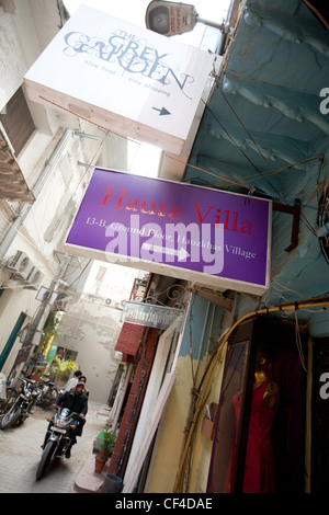 Boutiques and shops in Hauz Khas village, in south Delhi, India. Close to the ruins of Feroz Shah's 14th century medrassa. Stock Photo