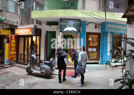 Boutiques and shops in Hauz Khas village, in south Delhi, India. Close to the ruins of Feroz Shah's 14th century medrassa. Stock Photo