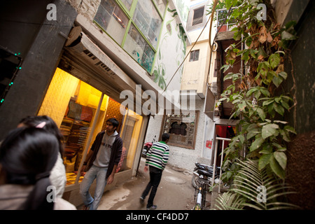 Boutiques and shops in Hauz Khas village, in south Delhi, India. Close to the ruins of Feroz Shah's 14th century medrassa. Stock Photo