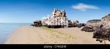 The demolished Shag Rock, a well-known landmark on the beach in the Christchurch suburb of Sumner Stock Photo