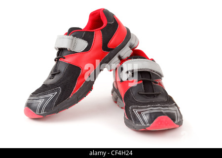 Pair of sports shoes, black and red colors on white background. Isolated. Stock Photo