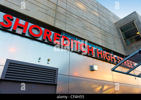 Signage outside Shoreditch High Street overground railway station. Stock Photo