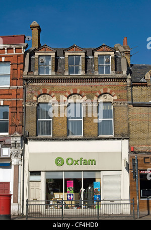 oxfam shop in twickenham, middlesex, england, occupying the ground floor of a victorian building Stock Photo