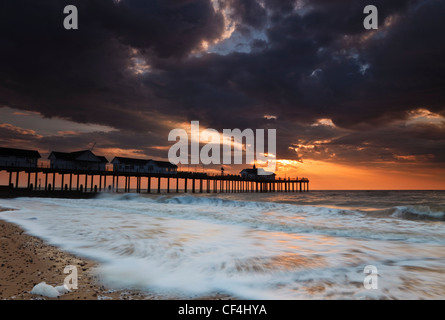 Storm clouds gather over Southwold pier in Suffolk at dawn. Stock Photo