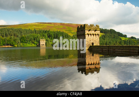 Derwent Dam reflected in the water of the reservoir. Stock Photo