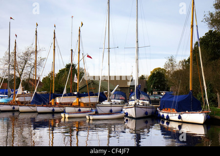 White yachts lined up at Upton Dyke in Norfolk. Stock Photo