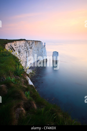 Looking towards Old Harry Rocks, from Handfast Point, Swanage, at dawn. Stock Photo