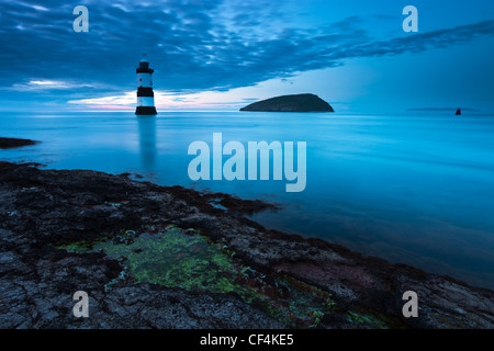 Penmon lighthouse and Puffin Island at Penmon Point on the Isle of Anglesey. Stock Photo