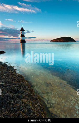 Penmon lighthouse and Puffin Island at Penmon Point on the Isle of Anglesey. Stock Photo