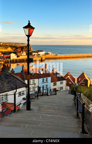 View to Whitby Harbour at sunset from the 199 steps leading from The ...