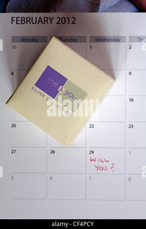 ring box me & you silver collection positioned on page of calendar for 29 February leap year with the words Will You? written on it leap year proposal Stock Photo