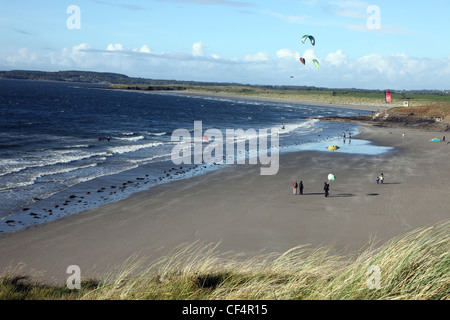 Kiteboarding on Rosses Point Beach, a popular holiday beach in Yeats Country. Stock Photo