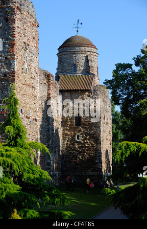 People walking in the grounds of Colchester Castle, an almost complete Norman castle completed around 1100. Stock Photo