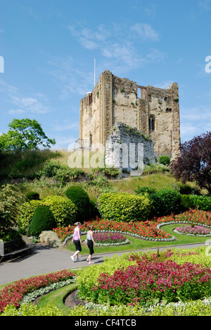 Two young girls walking in the grounds of Guildford Castle. Stock Photo
