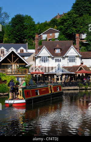 A barge on the River Wey Navigation by the Weyside Inn in Guildford. Stock Photo