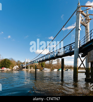 Supension bridge over the River Thames at Teddington Lock, the upstream limit of the tide on the River Thames. Stock Photo
