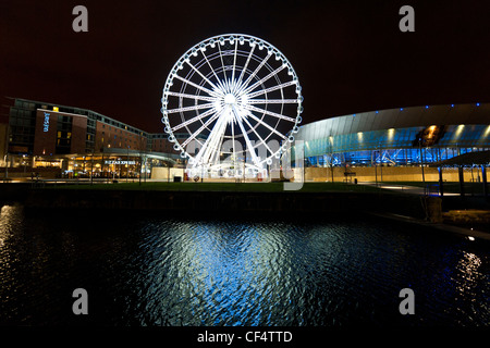 Night view of Echo Arena and Echo Liverpool Wheel reflected in the waters of Dukes Dock. Stock Photo