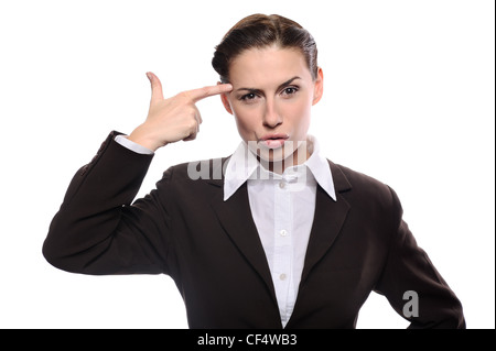 Bored young business woman making gun with her hand pretending to blow up her head Stock Photo