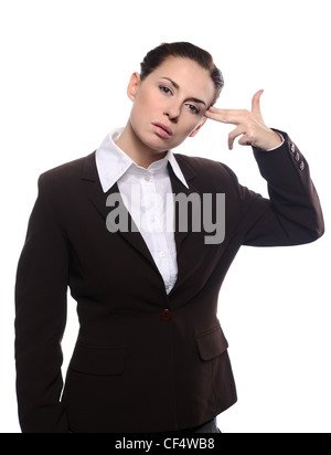 Bored young business woman making gun with her hand pretending to blow up her head Stock Photo