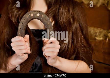 Horseshoe in female hands Stock Photo