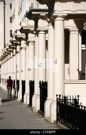 Numbered stone columns outside elegant Victorian terraced houses in Eccleston Square. Stock Photo