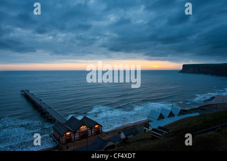 Sunrise over the Victorian pier at  Saltburn-By-The-Sea, the day after the Icelandic Volcano eruption April 2010. Stock Photo