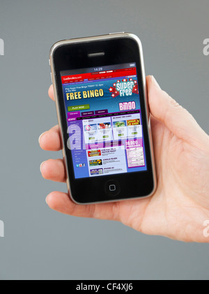 playing bingo on Ladbrokes website on iPhone Stock Photo