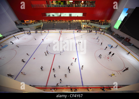 DUBAI APRIL 18: big covered skating-rink in Dubai Mall one largest mall in world on April 18 2010 in Dubai United Arab Emirates. Stock Photo