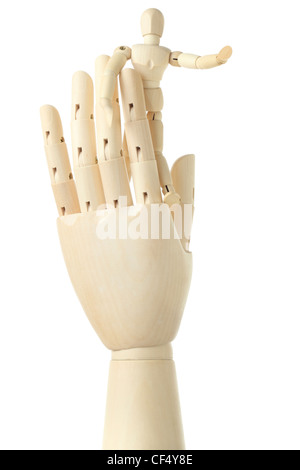 wooden figure of little man standing on big hand and pointing at right, isolated on white Stock Photo