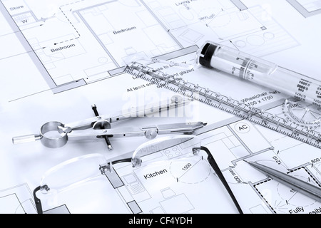 Still life photo of architectural floor plans with drawing instruments Stock Photo