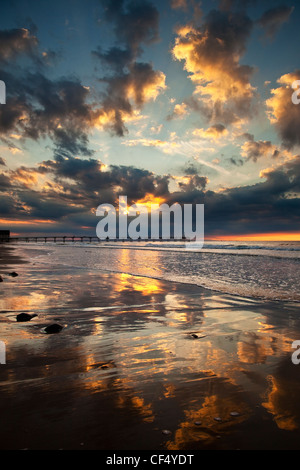 Sunset over the Victorian pier at Saltburn-By-The-Sea. Stock Photo