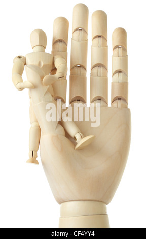 wooden figure of little man sitting on big hand, front view, isolated on white Stock Photo