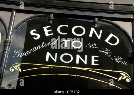 'Second to None - Guaranteed to be the Best' sign on a shop window in Brighton. Stock Photo