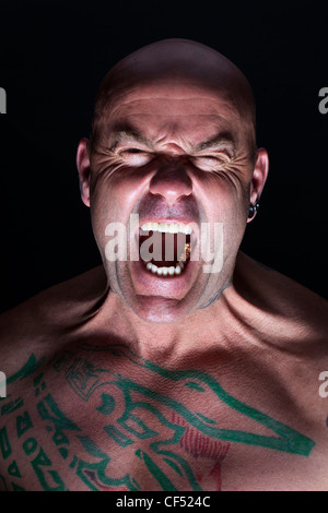 portrait of a man looking menacing Stock Photo