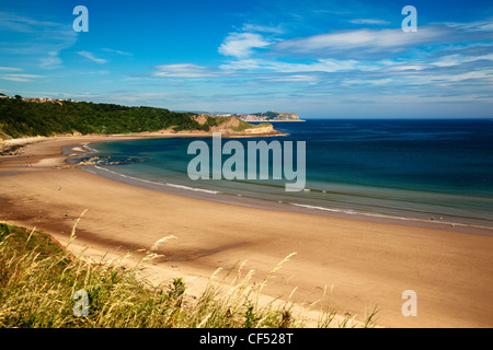 Sandy beach at Cayton Bay with Scarborough in the distance. Stock Photo