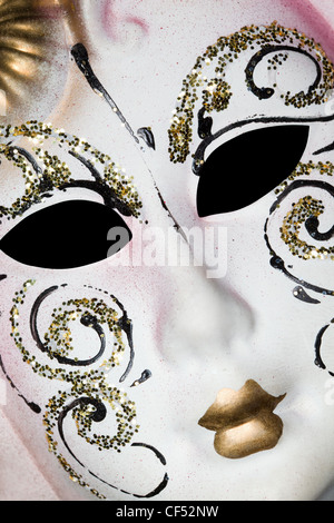 White Venetian mask with patterns, Lying on diagonal Stock Photo