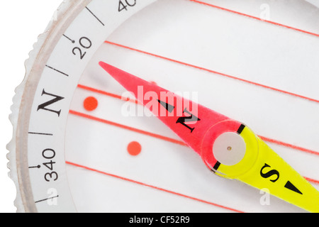 Fragment of plastic compass with an arrow specifying in north isolated on white background Stock Photo