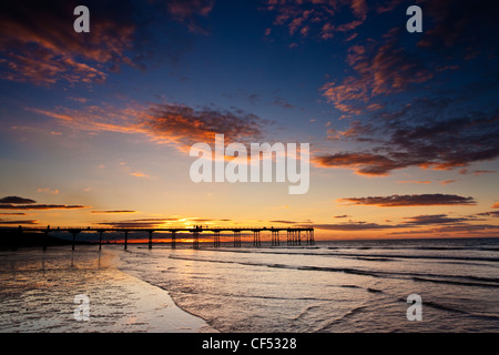 Sunset over the Victorian pier at Saltburn-By-The-Sea, the first and last on the North East coast. Stock Photo